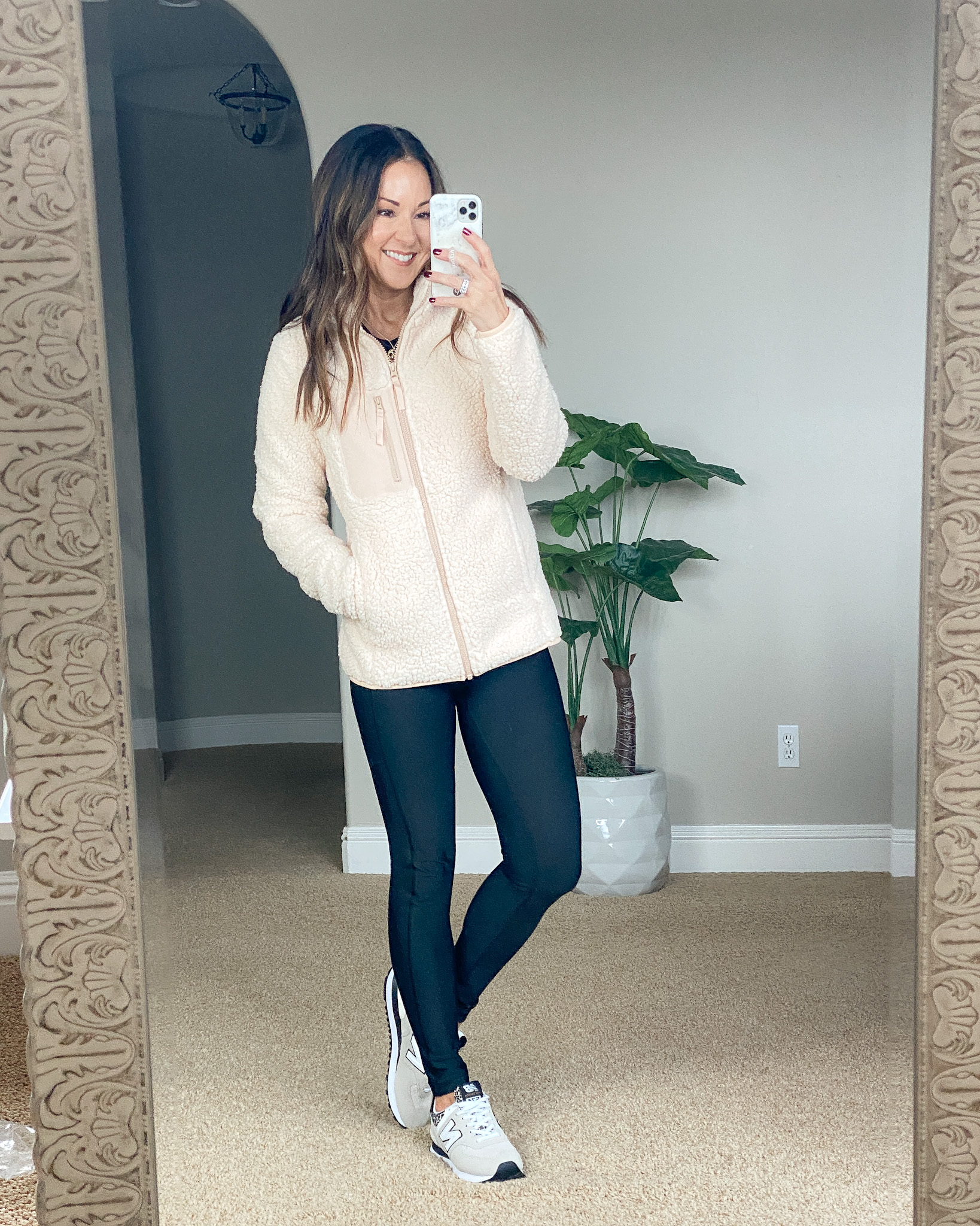  fashion item from december, cream sherpa jacket, black leggings with pockets, cheetah sneaker, new balance sneakers 