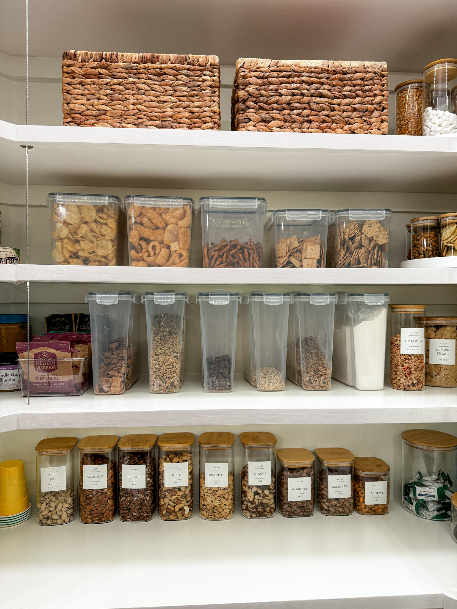 unlocking pantry perfection: insider look into a clutter-free kitchen | pantry, pantry organization, clutter-free, kitchen, basket, food storage, containers, air tight container, pantry storage, minimalist labels